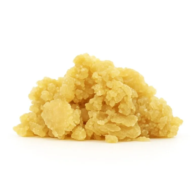Golden yellow sugar wax concentrate with a grainy, crystalline texture on a clean white background.
