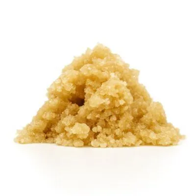 Photorealistic light golden cannabis concentrate displayed on a clean white background.