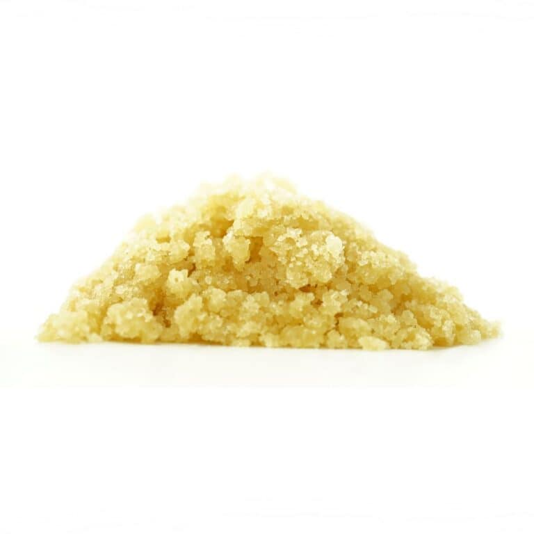killer queen Golden cannabis sugar wax concentrate photographed on a crisp white background with visible crystal texture and natural depth