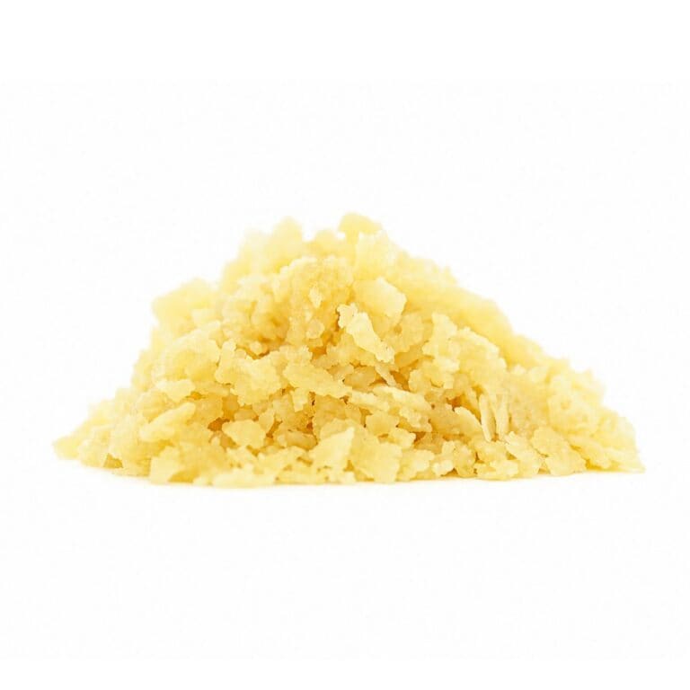 sunny d Golden cannabis sugar wax concentrate photographed on a crisp white background with visible crystal texture and natural depth