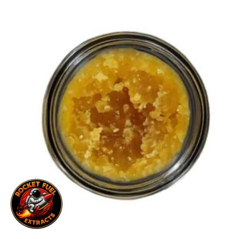 Open jar with golden, crumbly texture and granular consistency (close-up)