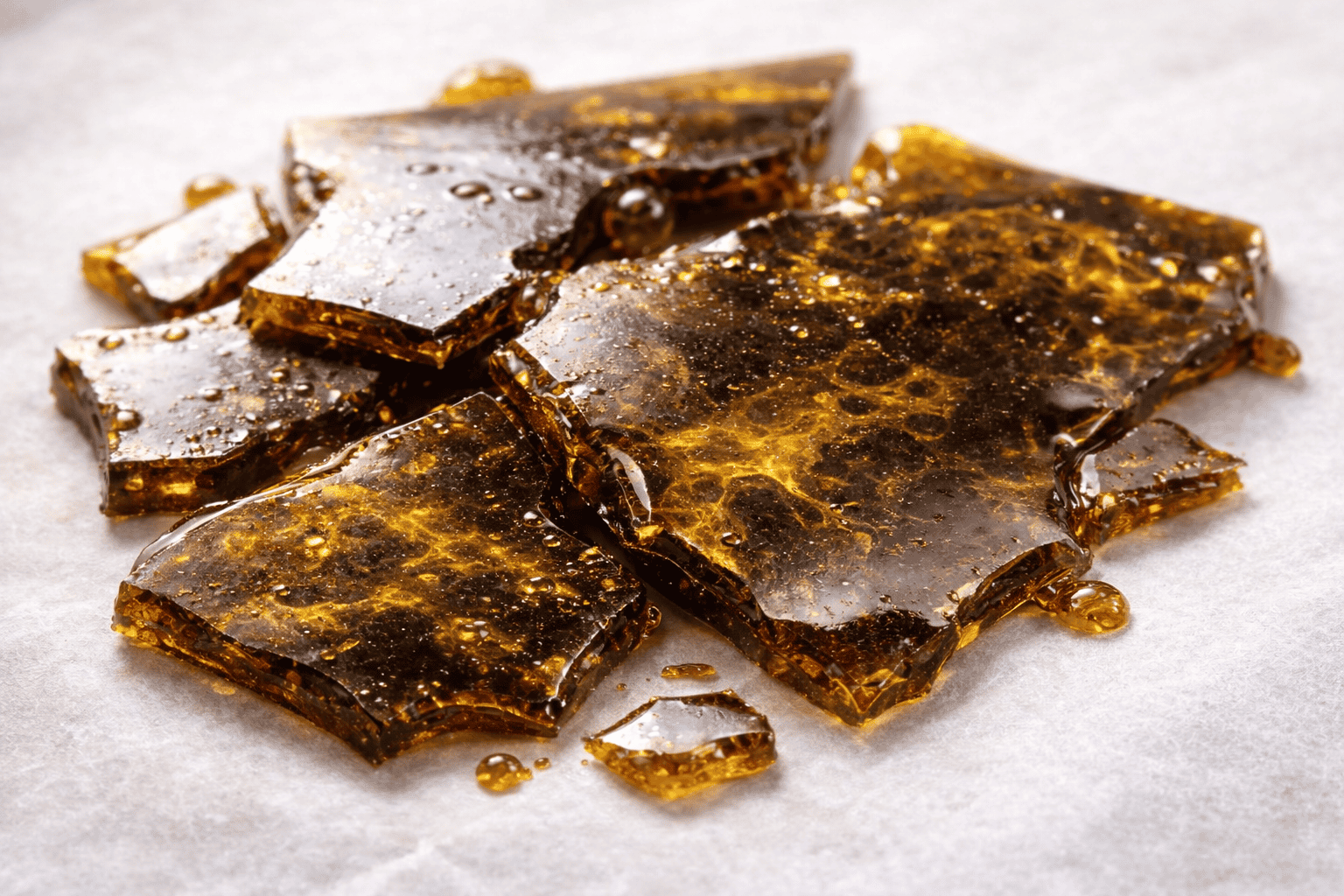 Dark brown bad shatter indicating low-quality extract