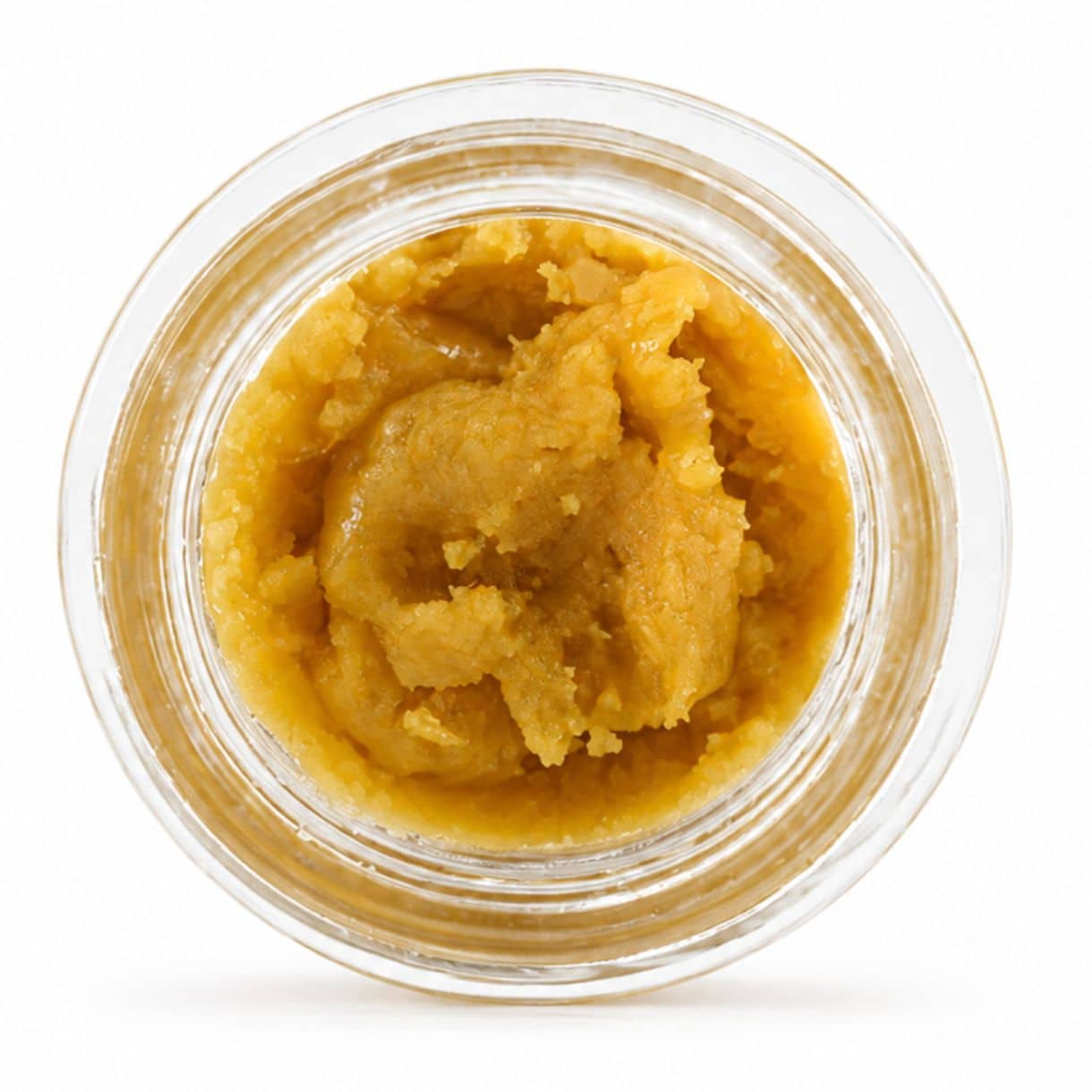 Open container of light-golden cannabis concentrate with a creamy, whipped texture on a white background.