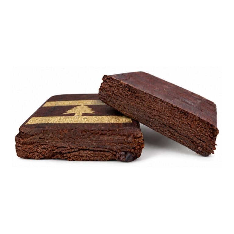 Red Lebanese cannabis hash blocks showing the cut interior and texture on a white background